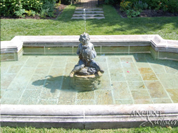 Antique rounded pool fountain from the 16th century with a middle pedestal and urn